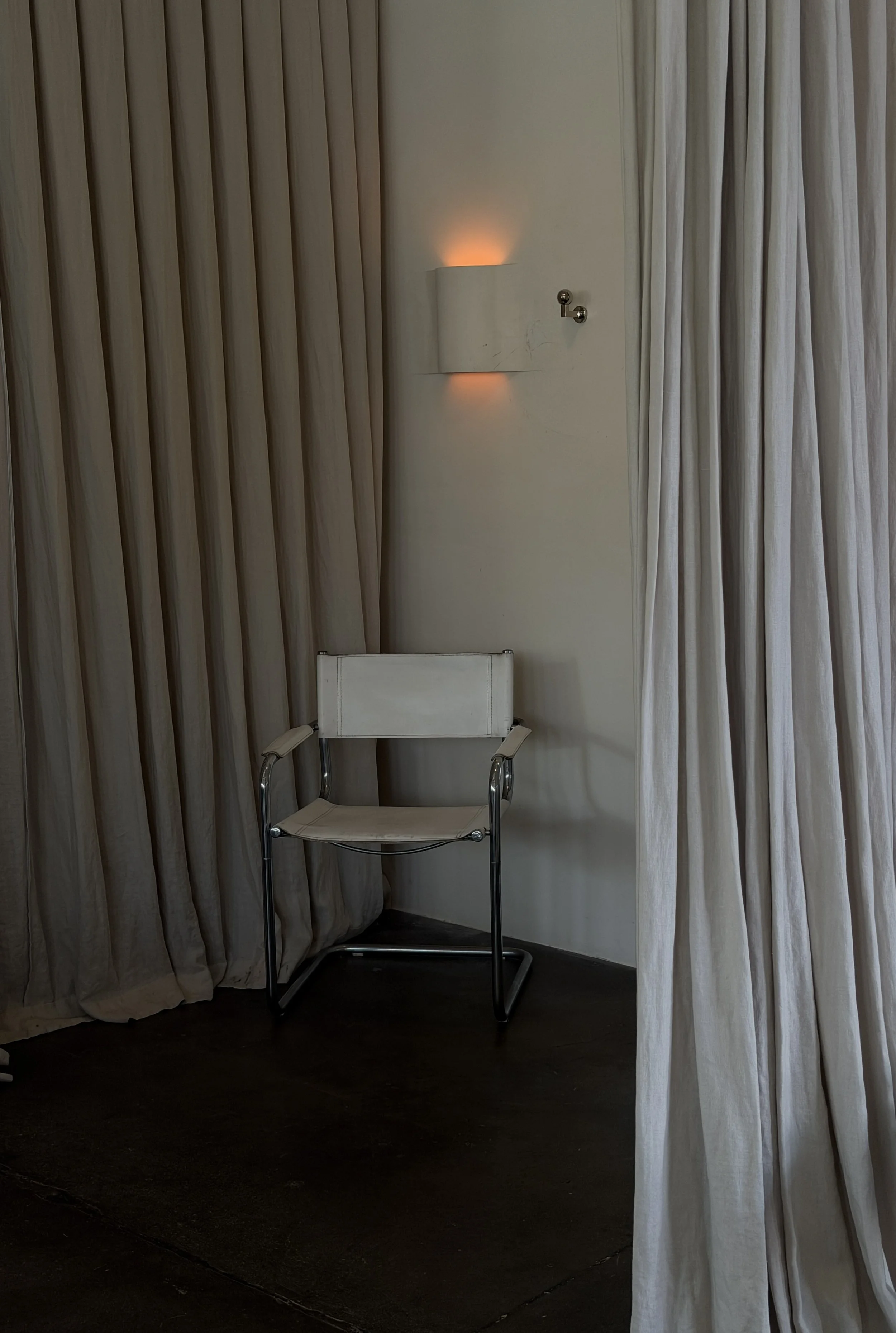 minimal interior design with white chair and white curtains