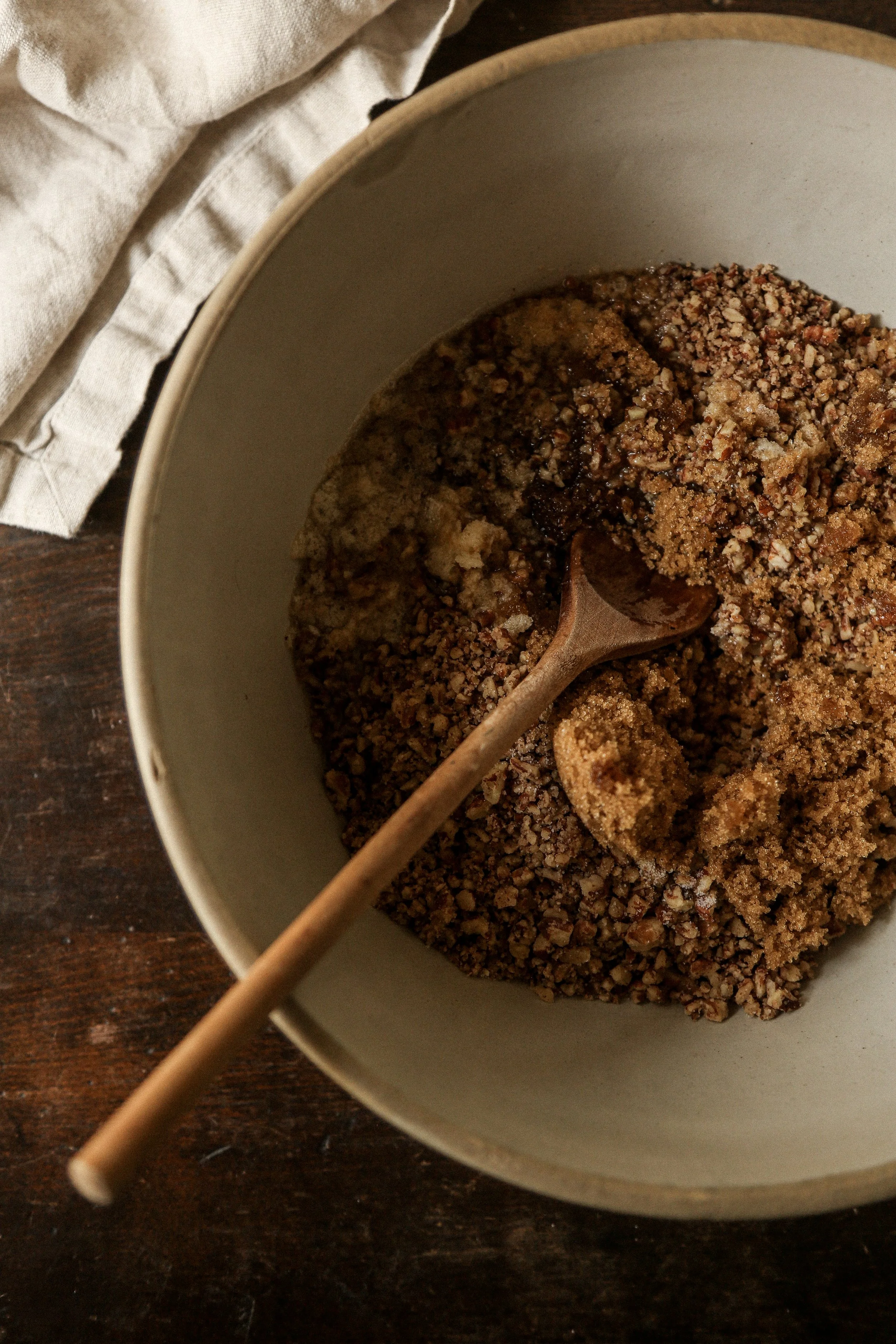 Chopped pecans, brown sugar, and melted butter combined for chocolate pecan torte crust