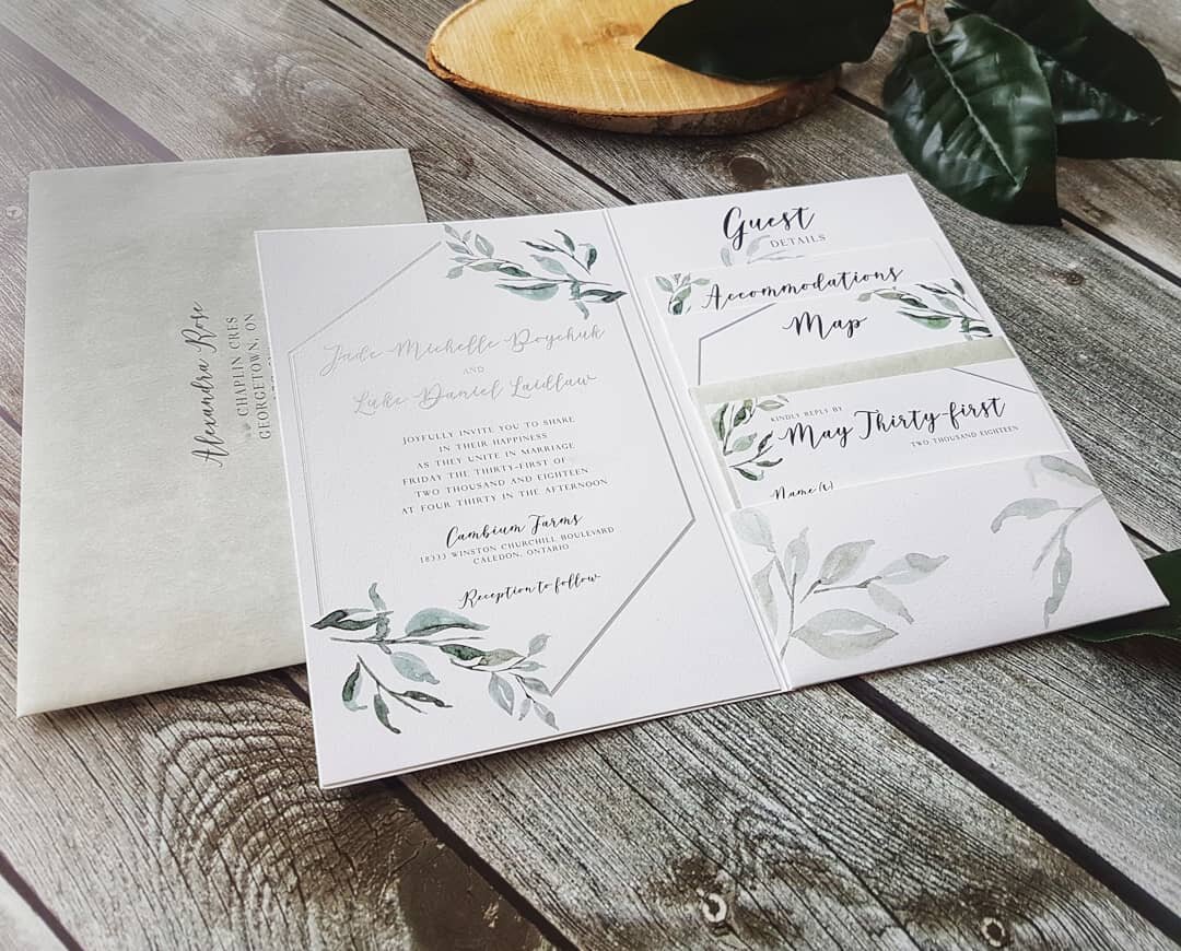 A summer wedding invitation suite that features lush greenery and crisp white cotton paper. Trendy botanical and geometric inspired invitation, with matte silver foil accents and soft gray envelopes, complete with a matte silver envelope liner.