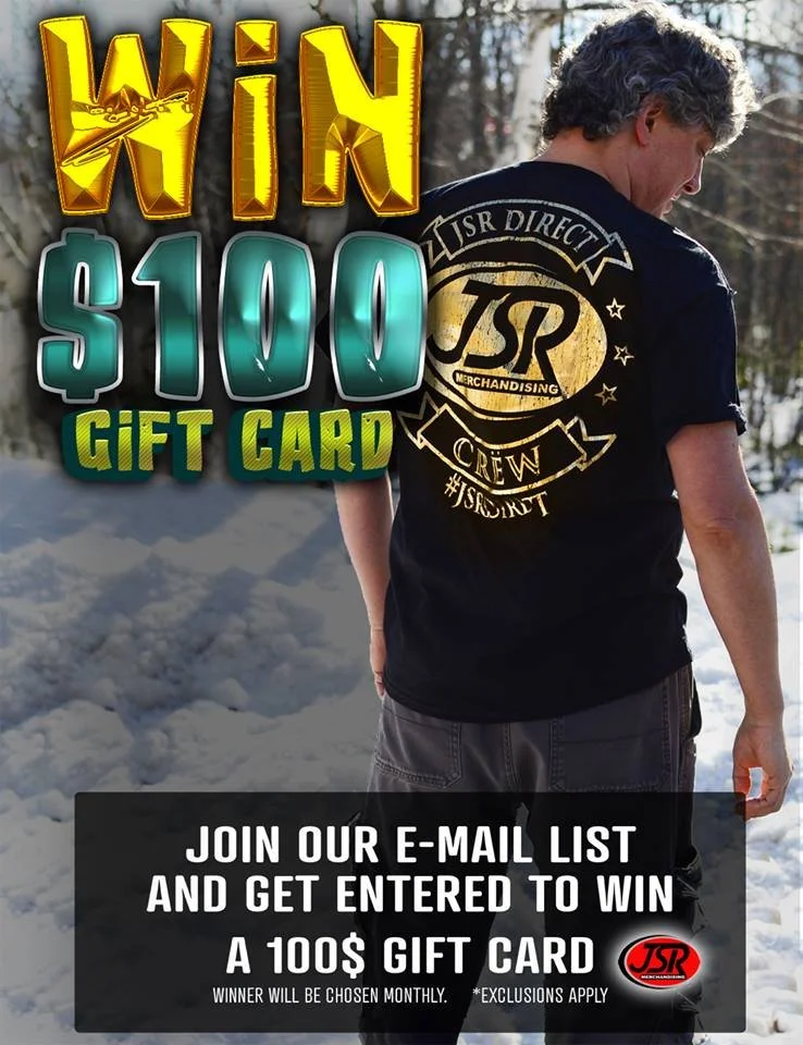 A man wearing a black T-shirt with gold lettering on the back, standing outdoors in a snowy area, promoting a $100 gift card giveaway for joining an email list.