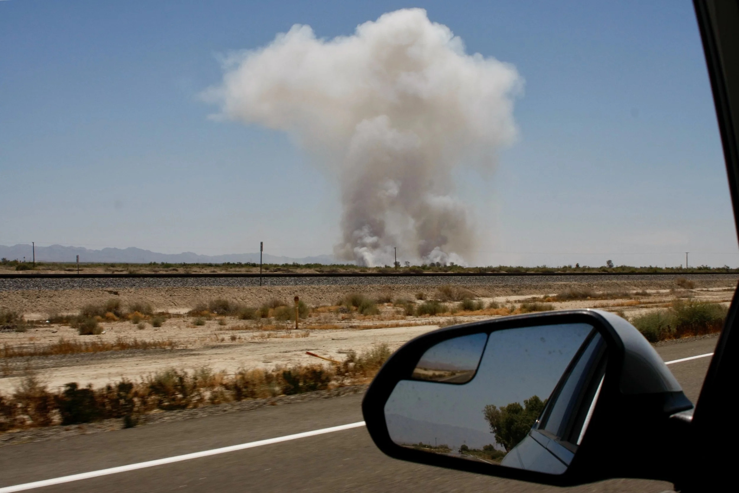 A small brushfire scorches the desert just outside of Slab City, Calif. on May 17, 2017. (Photo by Ethan Jakob Craft.)