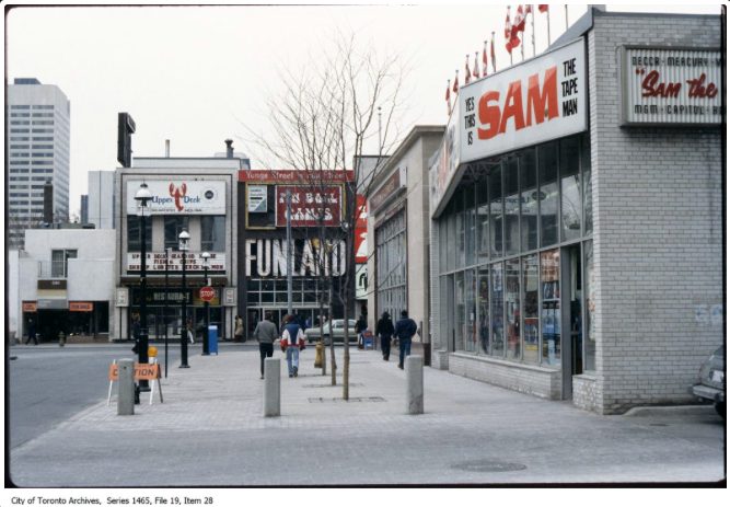 Gould Street looking west to Yonge, 1980s, featuring Sam the Tape Man, an additional Sam the Record Man property. Ryerson’s modern SLC library building now occupies the space.