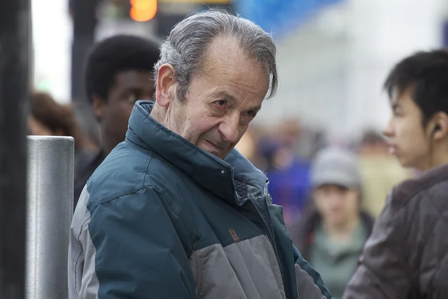 Sarko, the infamous Believe Guy, stands preaching just outside of Toronto’s Yonge-Dundas square, 2012. (Photo courtesy of elevature .)