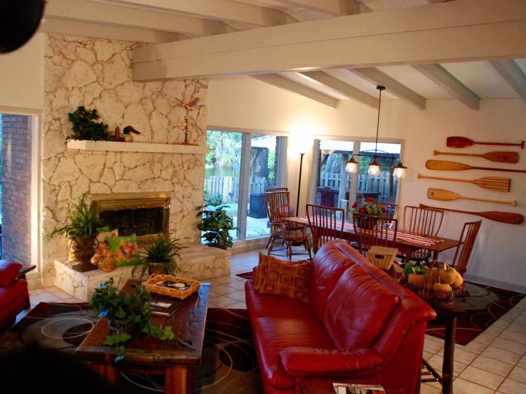 The great room features a river vista with a spacious dining-entertaining area.