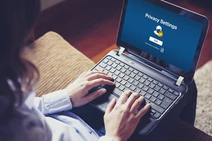 Picture of a person logging onto a laptop