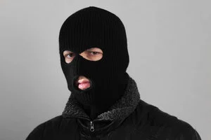 Picture of a burglar in a ski mask
