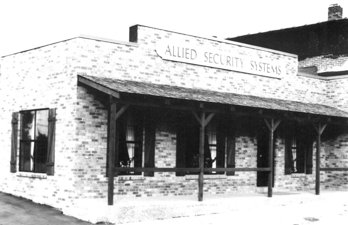New Allied Security Systems building in 1976, brick faced building with porch and covering - NCA Alarms Nashville TN