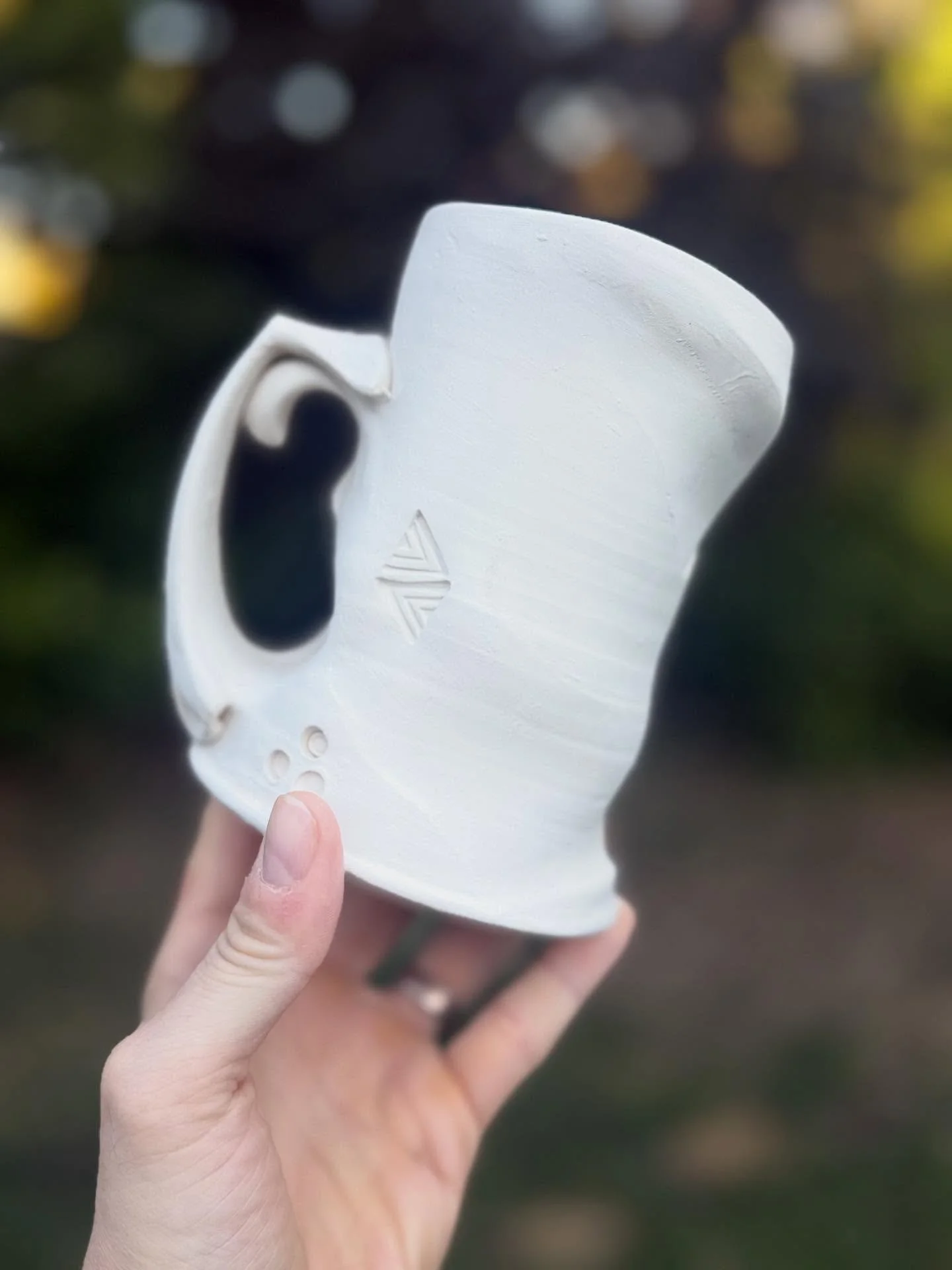 Evening light on a bone dry mug destined for the #fishcat kiln . . . @dwaynespots and I are gearing up for a wood / soda workshop in collaboration with @eastcreekart . . . Can&rsquo;t wait to get the firing crew together to jump into the process.  Th