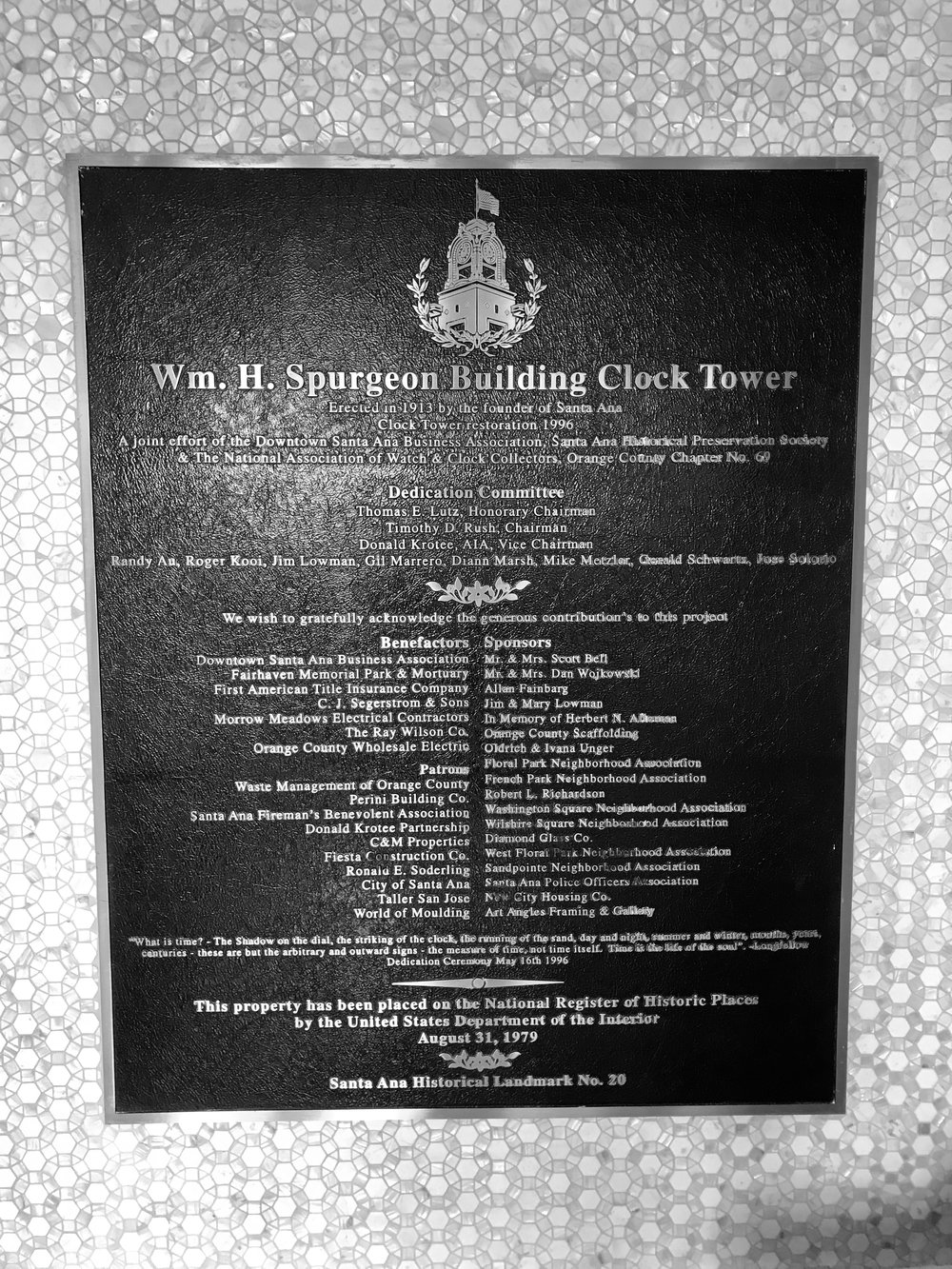  Dedication sign for clock tower in building lobby 