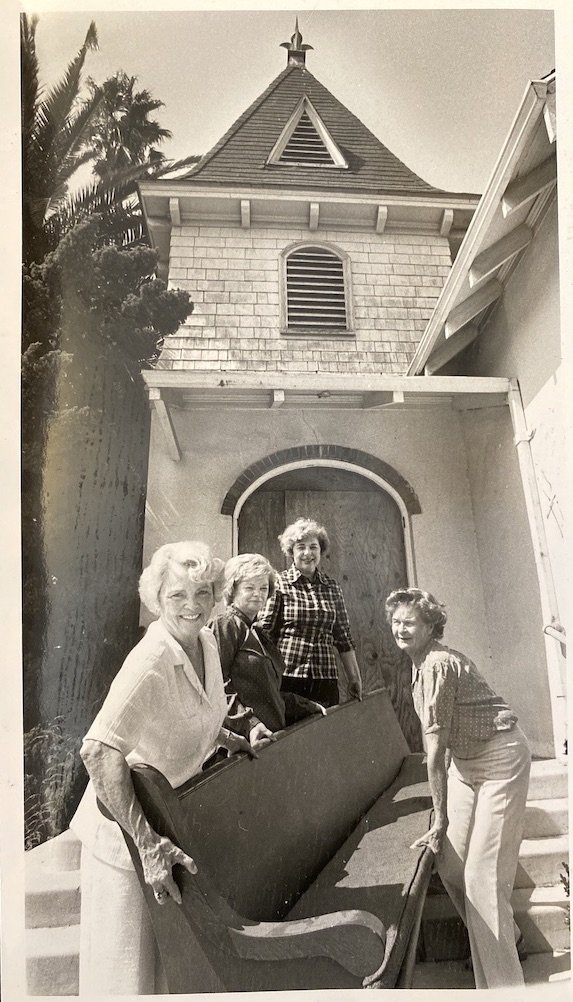  Moving pew from condemned church to Carnegie. Left to right: Betty Lillis, Diann Marsh, Dee Noble, and Midge Taggart, c. 1982. Courtesy Anaheim Heritage Center.  