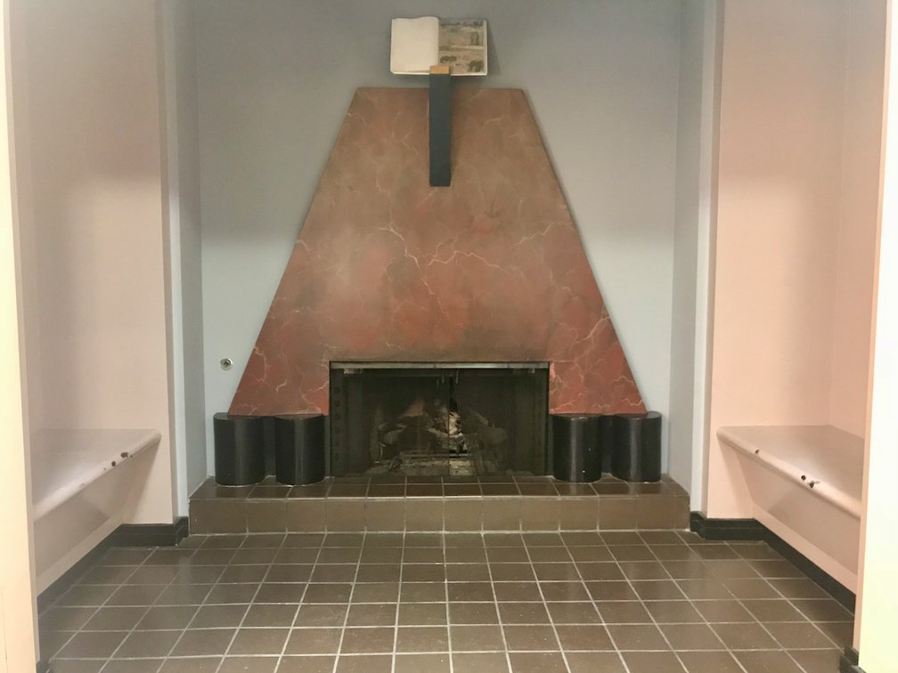 Fig. 10 Fireplace and sculpture, adult reading room.