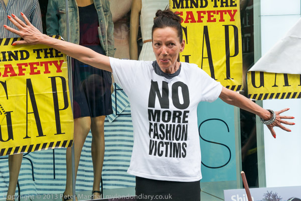 Katharine Hamnett standing in front of a Gap store window wearing her ‘No More Fashion Victims’ t-shirt.