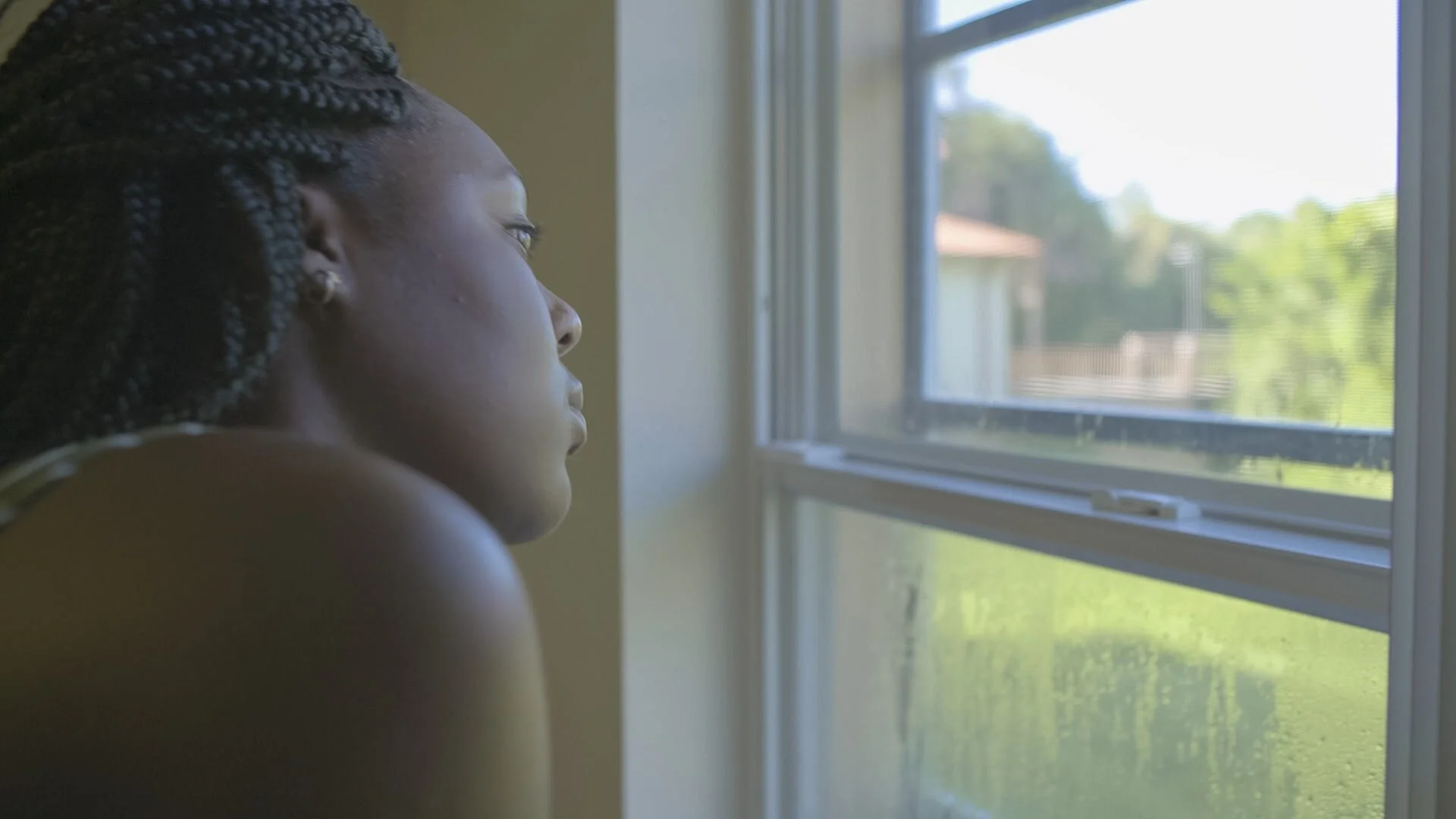 1. 17..._Kiki CU looking out window_photo by Lindsay Fitzgerald_© Makin’ Movies Inc. 2019.jpg