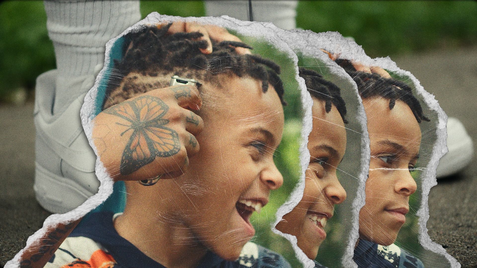 A collage of three torn photos of a woman with dreadlocks smiling and looking right, with a tattooed hand holding a camera close to her ear, on a gray outdoor surface with greenery background.