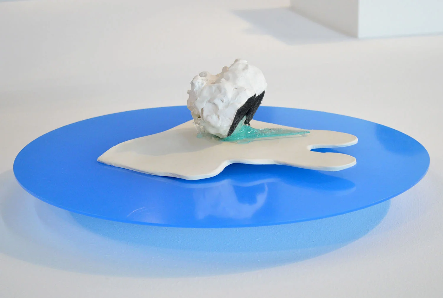  Flocky , 2014, glazed ceramic, flocking, porcelain, resin, acrylic circle, 6 x 19 x 19 inches 