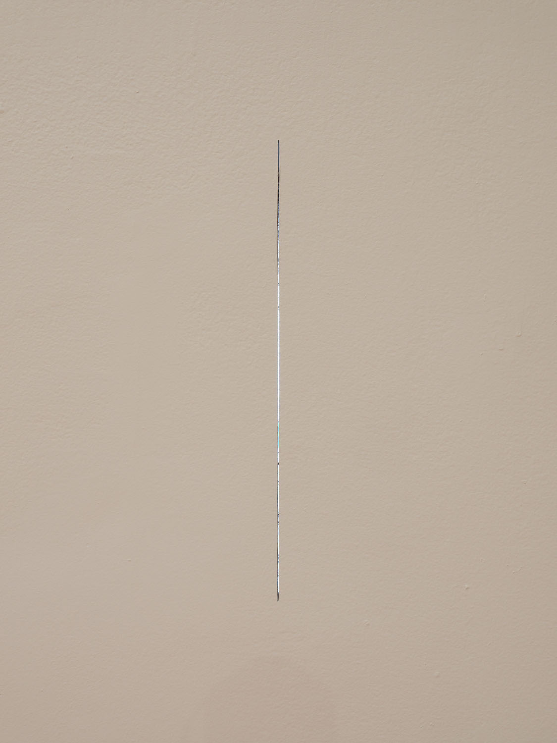   Outside-In, Inside-Out, ( detail,)   2018, line cut through perimeter museum wall, sheetrock, paint, 21 x 0.875 x 0.5 inches 