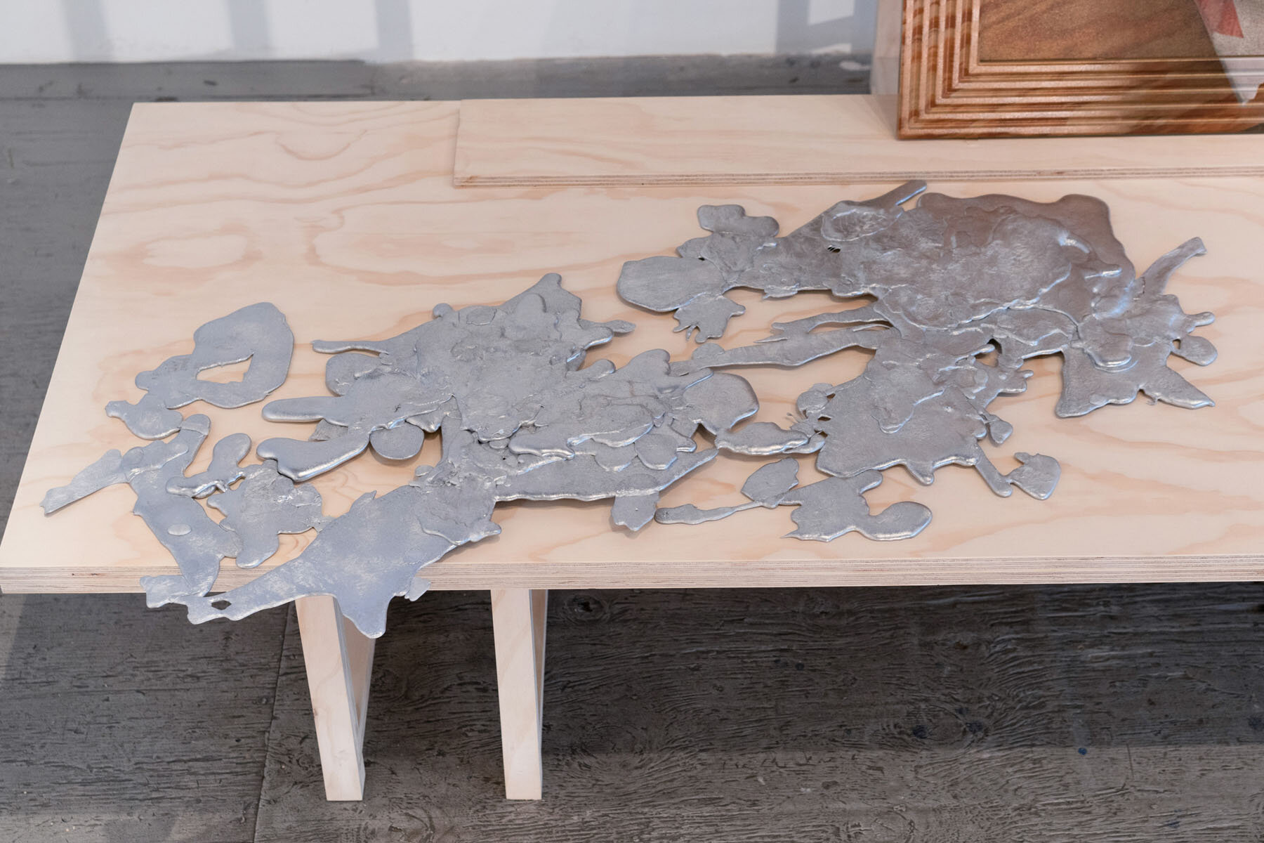   Large Stain , 2019, poured aluminum 49 x 21.5 x 1.5 inches 