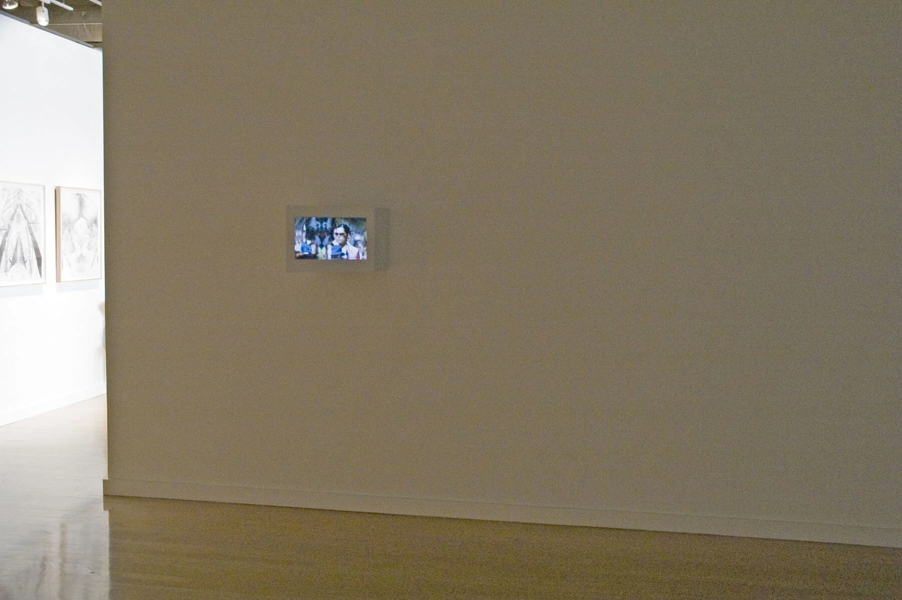   Roundabout Before Through Behind , exhibition view, 2006, 5-minute animation loop with sound, wood box, mirror mylar, speakers, 16 x 20 x 21 inches 