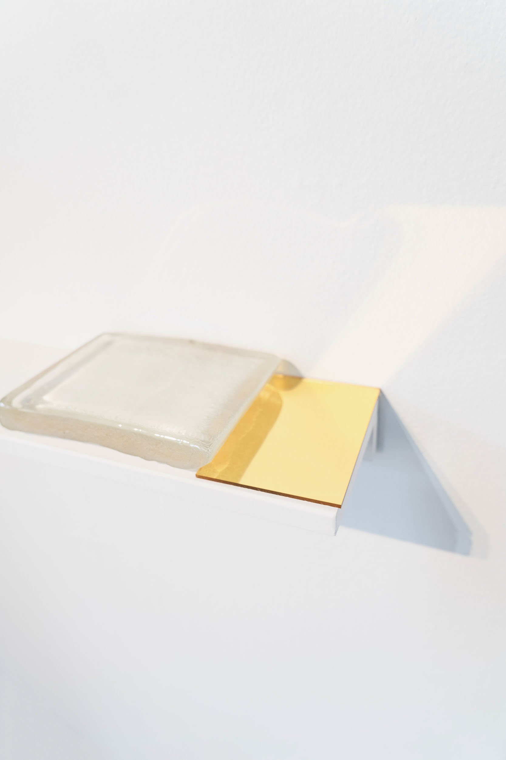   Postcard from the past , 2024, glass, sand, mirrored plexiglass, 1.25 x 10.25 x 5.5 inches 