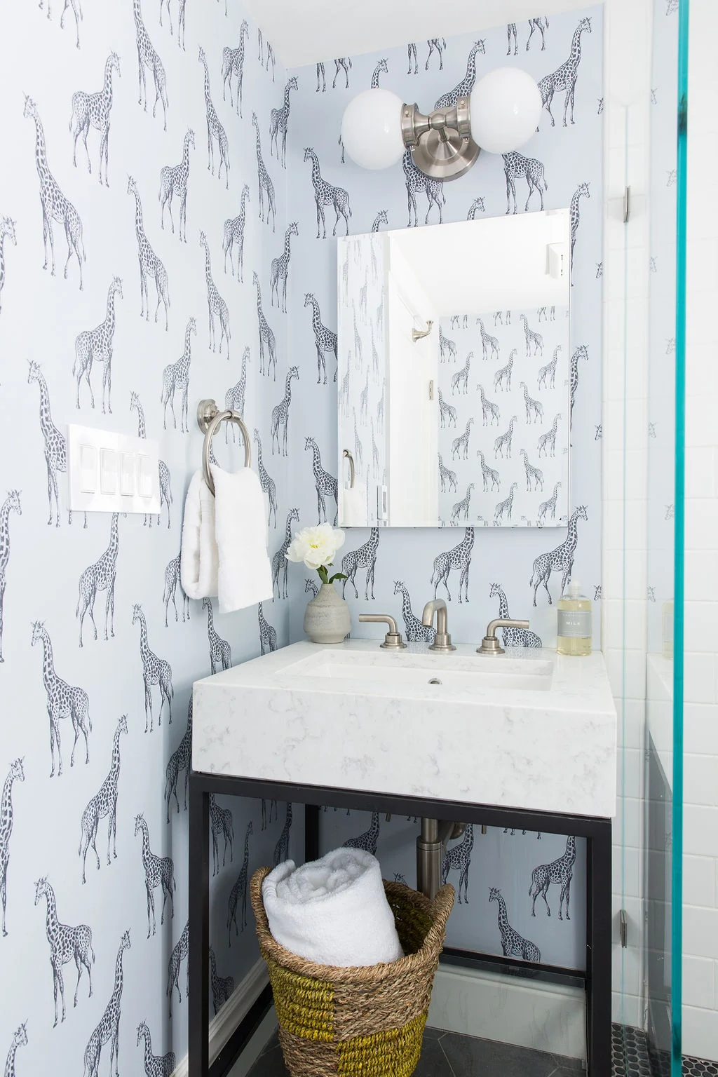 Love-&-Interiors-San-Francisco-Pacific-Heights-Fun-Blue-and-Gray-Guest-Bath-Giraffe-Wallpaper-Marble-Vanity-and-Black-Penny-Tiles.jpg