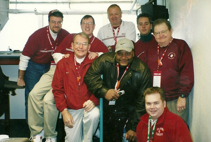 Photo courtesy of Michael Dean, taken at the 2002 Cotton Bowl. From left-to-right starting at the top, Jeff Couch, Michael Dean, Terry McLemore, Ron Benton, Bob Barry, Sr., Keith Jackson, Merv Johnson, and author Jake Fisher.
