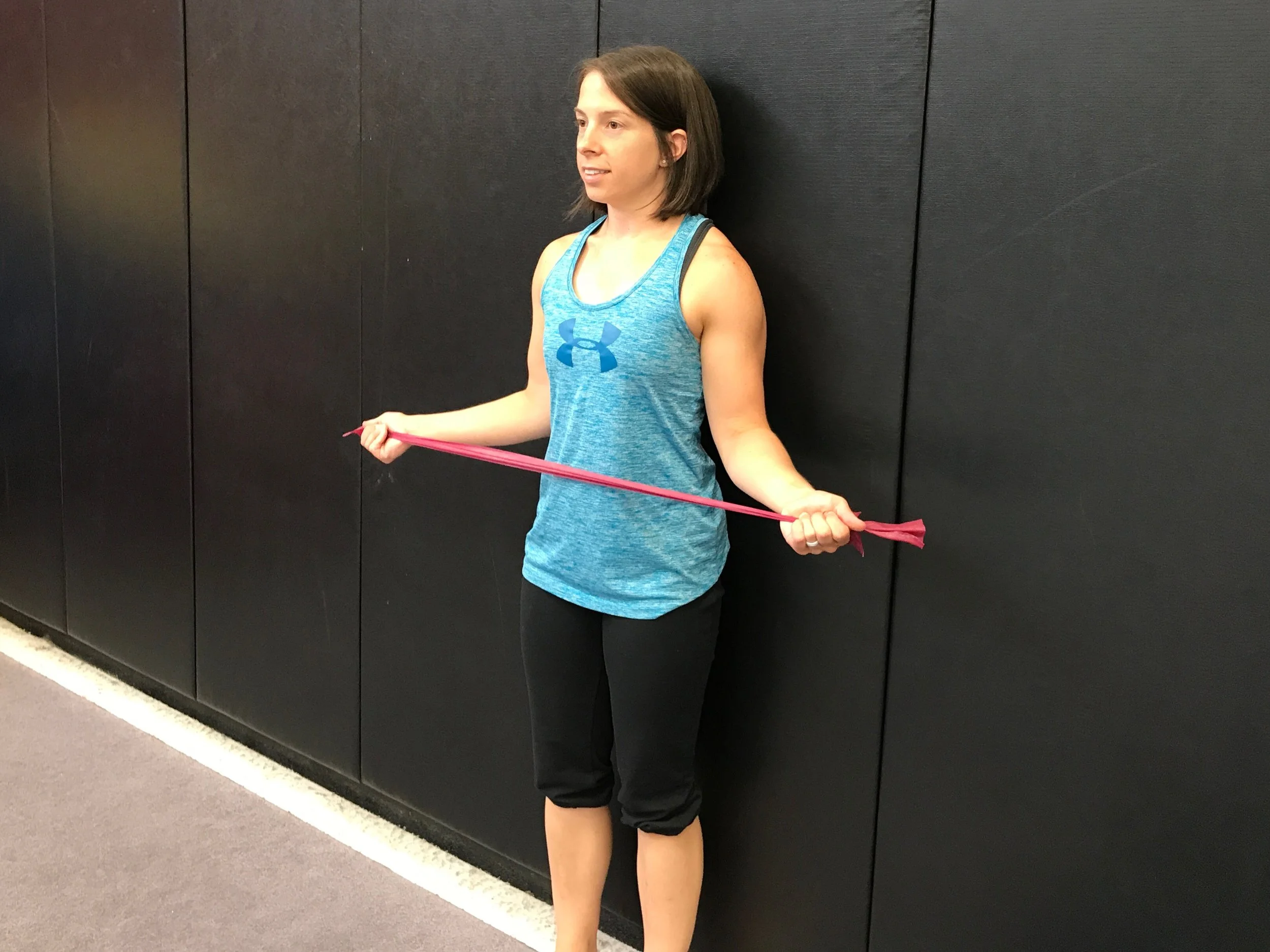 Exercise: Squeeze the shoulder blades together and twist the arms out. Then return to the starting position. (Be sure to keep the head neutral and body upright.) Be certain that the elbow remain bent and that the rotation is coming from the shoulders and not extension of the elbows.