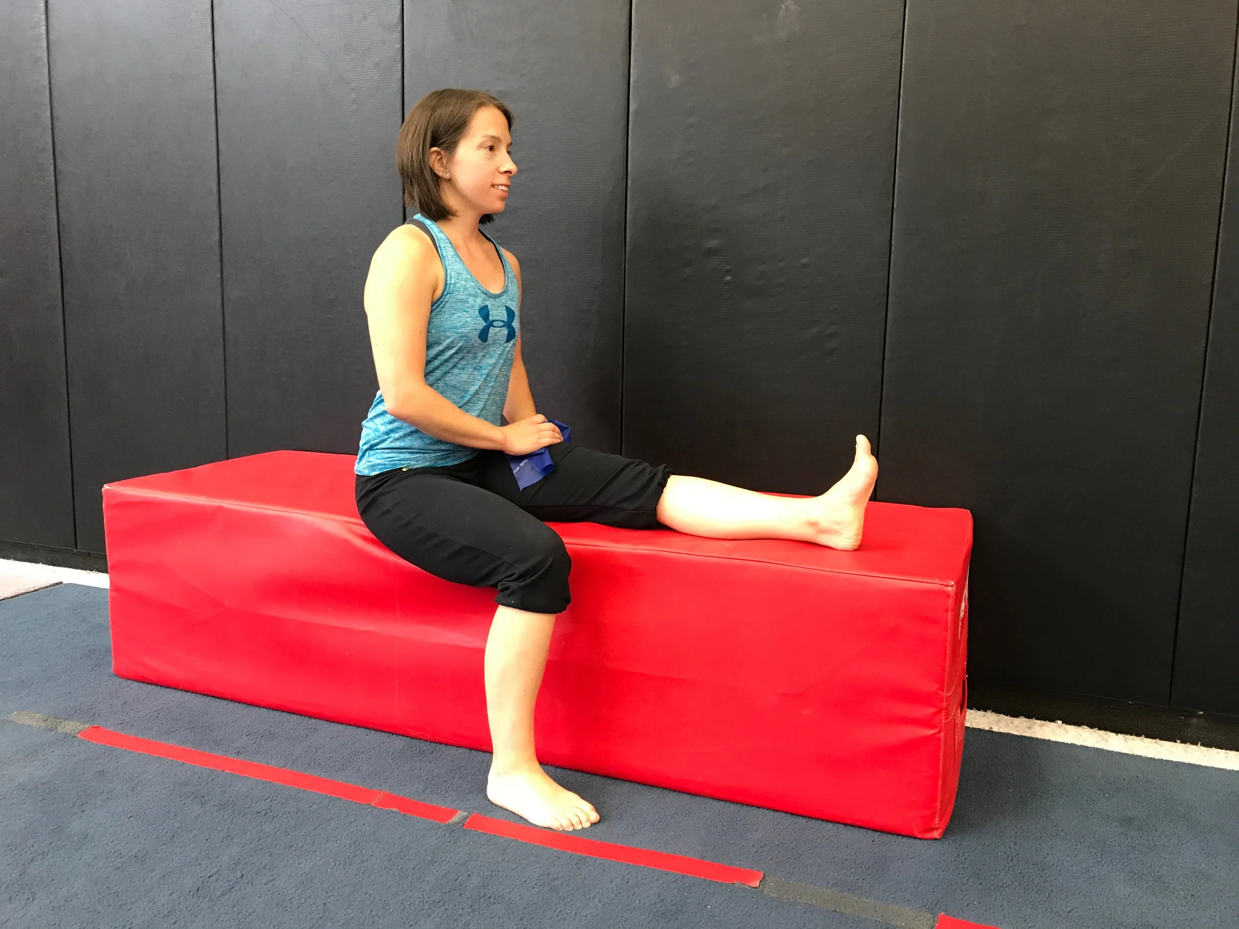 Starting position: On the edge of a table/bed with the targeted leg straight. Back straight & toe up on that side.