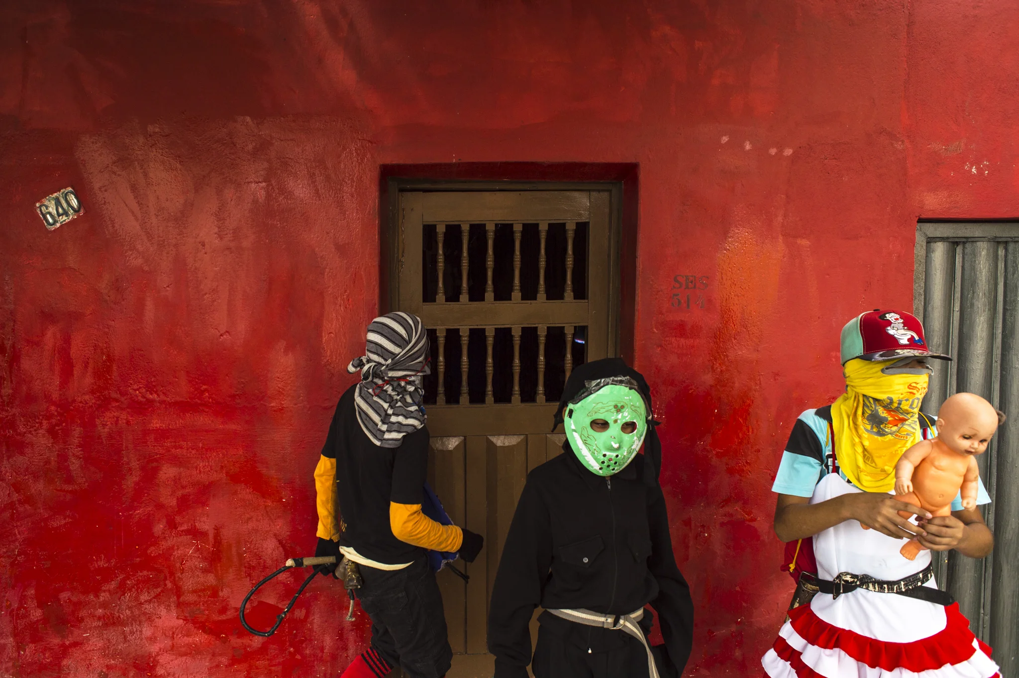  A group of dressed young boys is seen knocking at the doors of the small village in Sertao Pernambucano, Brazil. This old tradition, an equivalent of America's halloween, takes place during the Holy week and it seen as a pretext to exchange food goo