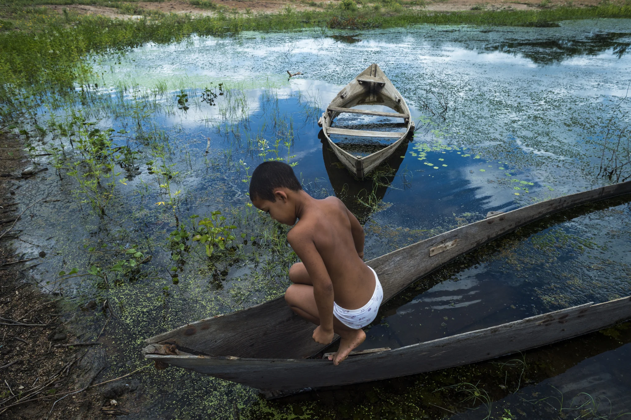  A child explores what remains of an artificial lake near his house, in proximity of Serra Talhada, Brazil. Sertao is experiencing the hardest drought of the last 50 years, with absence of rain since 4 years in several areas.&nbsp; 
