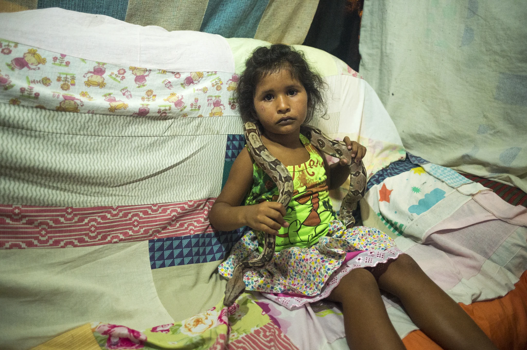  The daughter of a circusman who's travelling across Northeast Brazil, poses for a portrait asked by his father while camped in the city of Ouricuri, Brazil.&nbsp; 