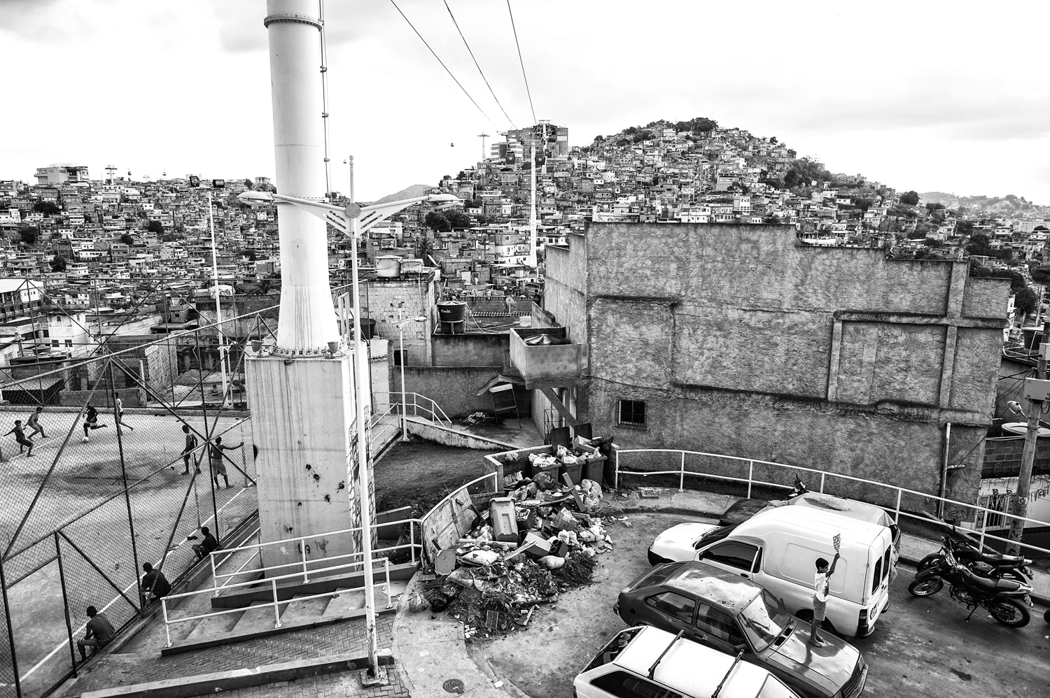  Complexo do Alemão, one of the largest favelas of Rio de Janeiro, seen by Teleferico station.
This cable-propelled transit system funded with 120 million dollars by the federal government, is criticized by favela residents because the service is too