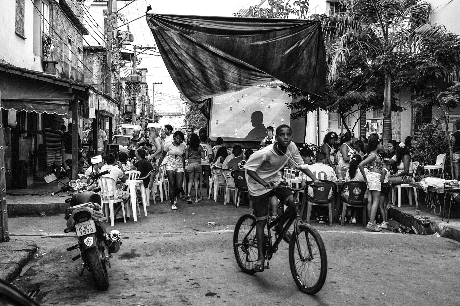  A giant screen is seen in the middle of a crucial street in favela of Complexo Maré, in order to watch a Brazil's World Cup match. 