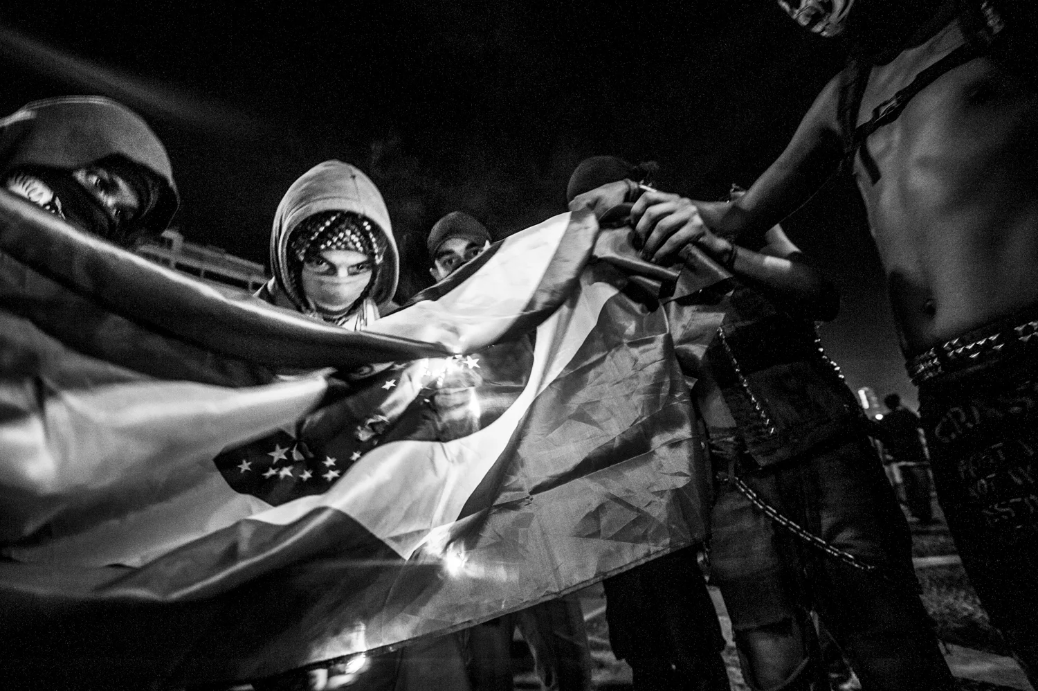  Anarchists are seen burning the brazilian flag after Copacabana exploited for Neymar's goal over Croatia, in the middle of the first World Cup match. 