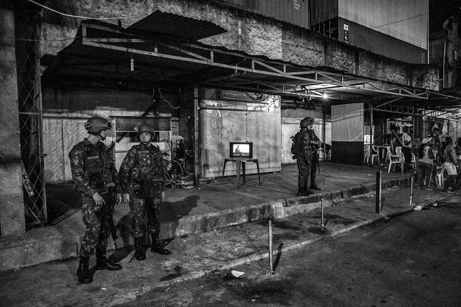  Militars are seen patroling inside Complexo da Marè, minutes after a World Cup match. 