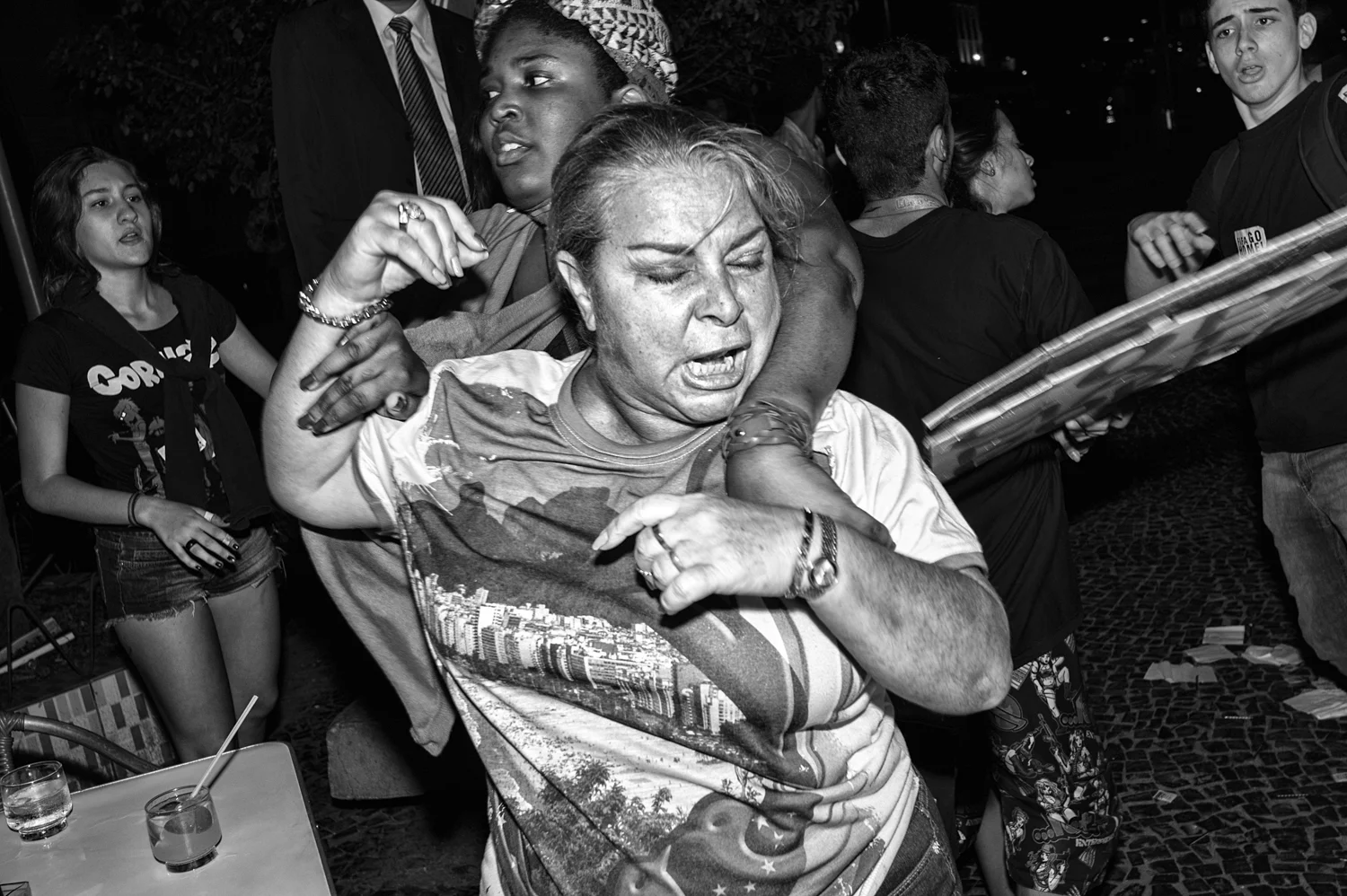  UnA Brazilian football team supporter getting enraged with anti World Cup protestors and then arrested by Military Police for a brawl broke in front of a Copacabana's restaurant. 