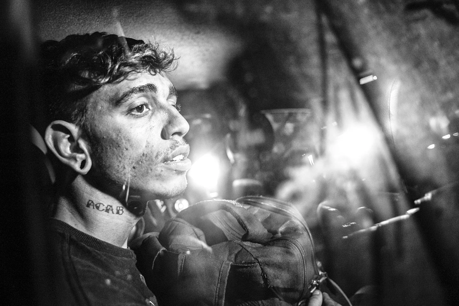  A young anarchic protester inside a police car, arrested during an anti World Cup riot in Rio de Janeiro in this June 4th, 2014. 