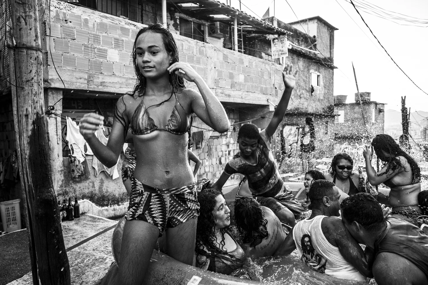  On a hot Sunday, residents of favela da Providença are seen playing in a inflatable pool positioned in the hearth of the first slum of Rio de Janeiro. 