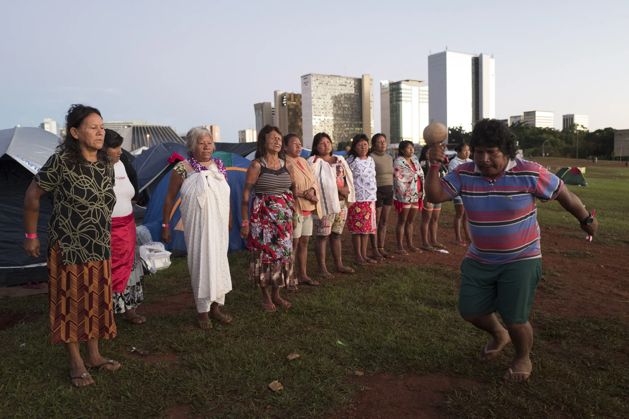  Indigenous people Tupiniquim ritual of prayer at sunrise in Free Land Camp in Brasilia. 