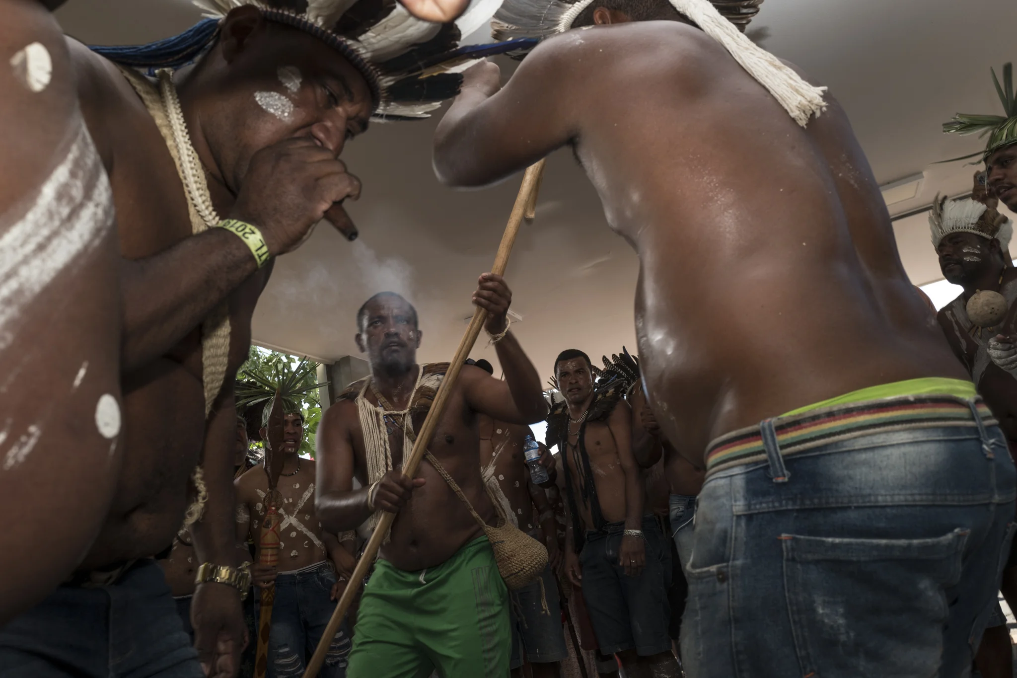  Blocked by police, Pankararu warriors perform a ritual in front of the Brasilia health ministry during Free Land Camp protests 