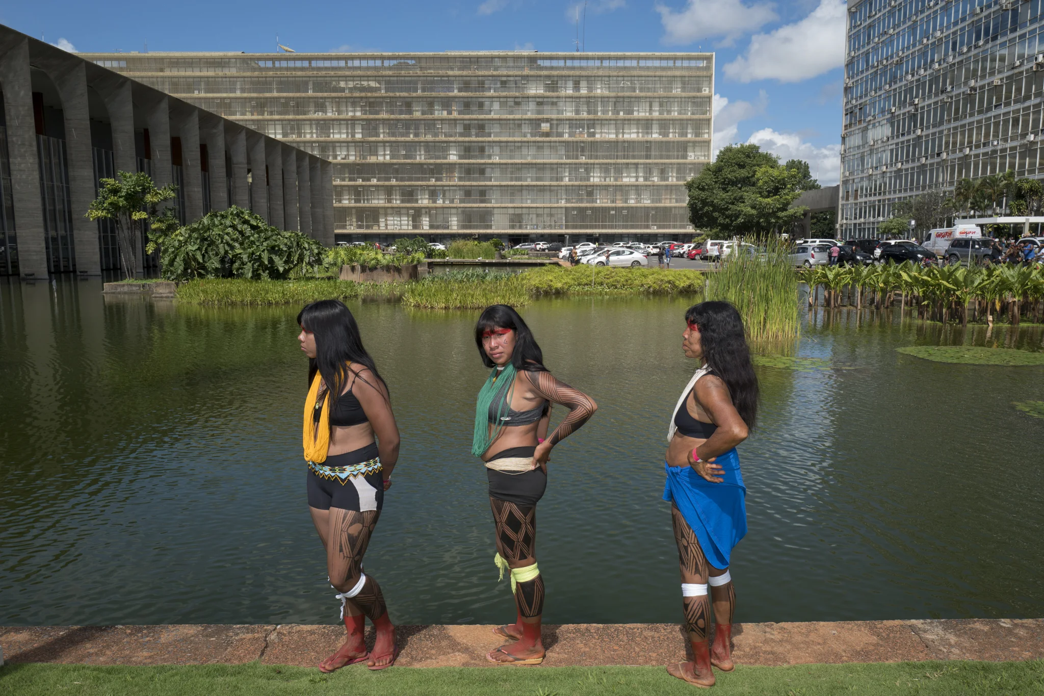  Waiapi women wait at the edge of an artificial pool at the headquarters of the Ministry of Foreign Affairs of Brazil. during the Free Land Camp protests in Brasilia. 