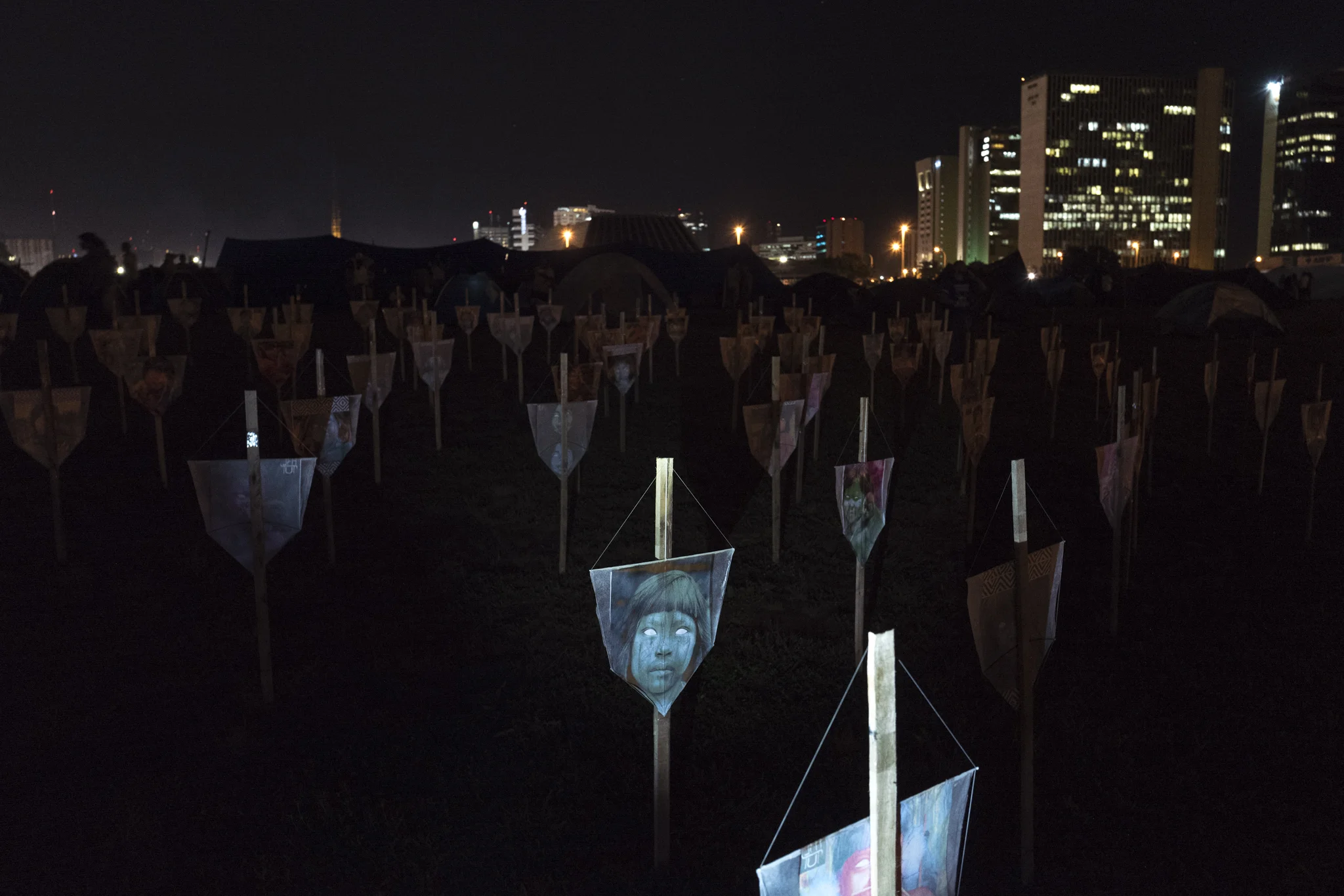  An installation of kites positioned as tombs is seen inside the Free Land Camp, in memory of the number of indigenous murdered in the Country this year. 