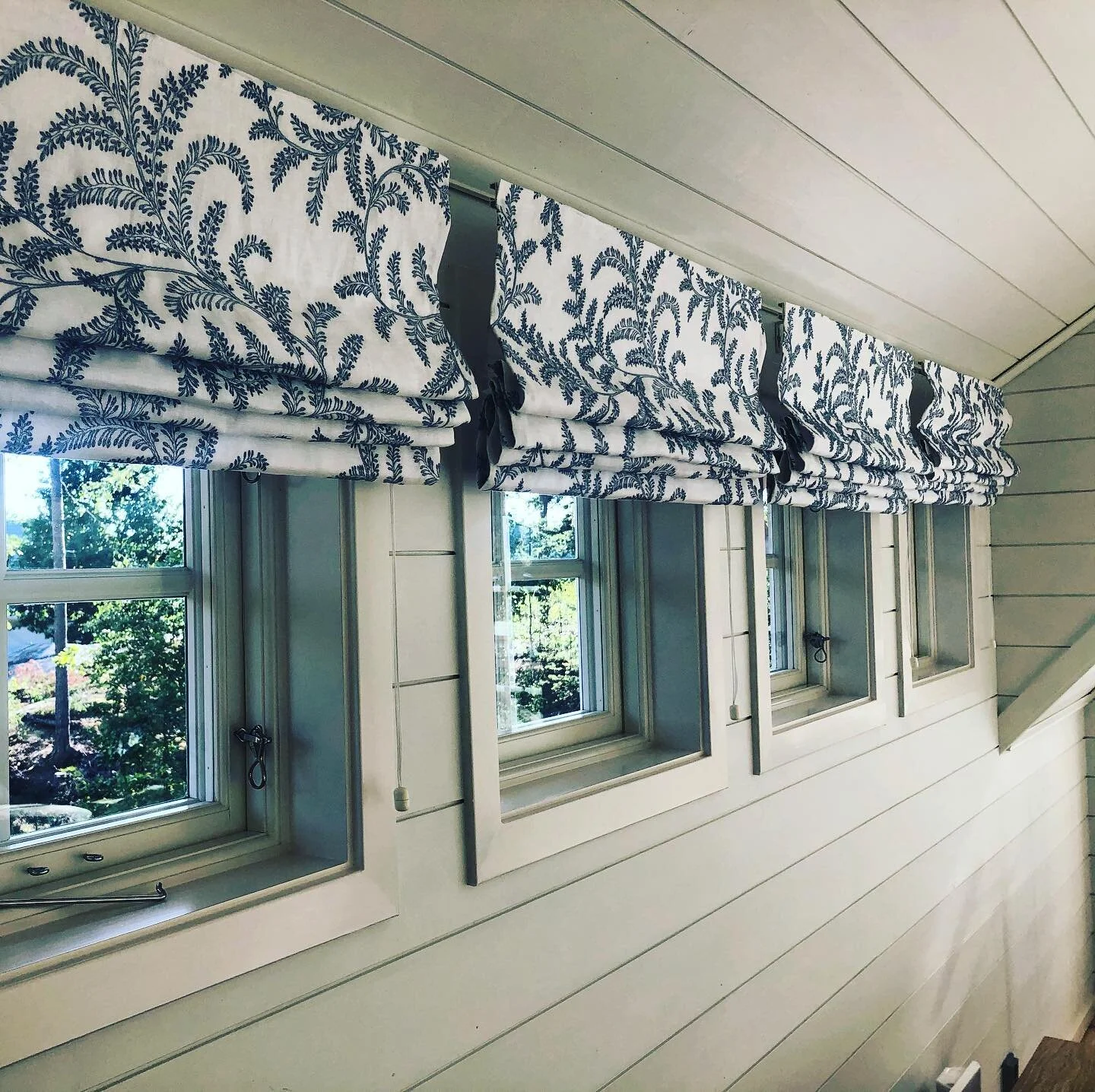 Simple row of roman blinds in Melina Blue @colefaxandfowler