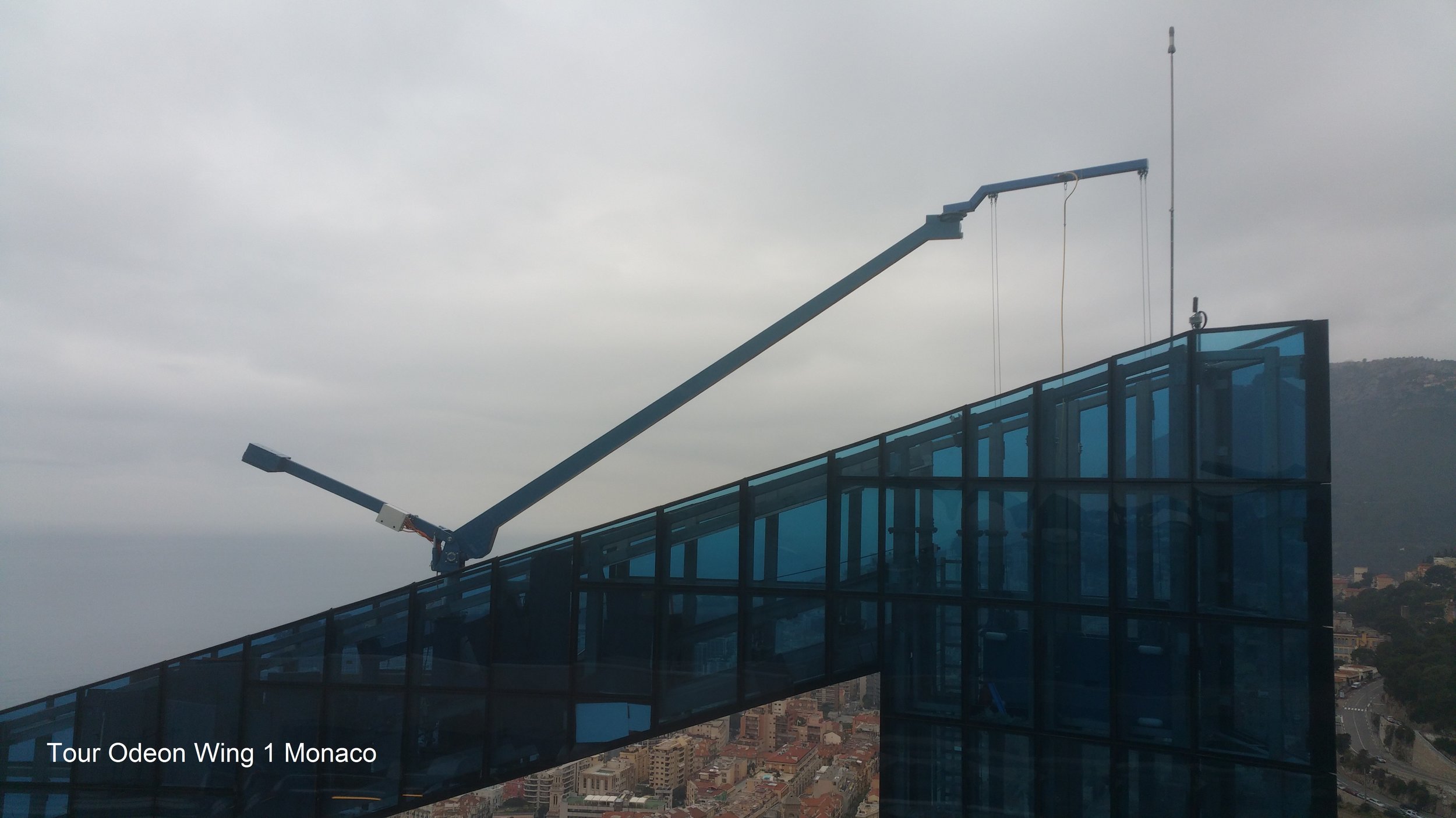 Above: The BMU system on Odeon Tower utilizes a luffing jib & counterweight together with telescopic mast to clear the roof perimeters when in operation and be able to hide completely when in parking.