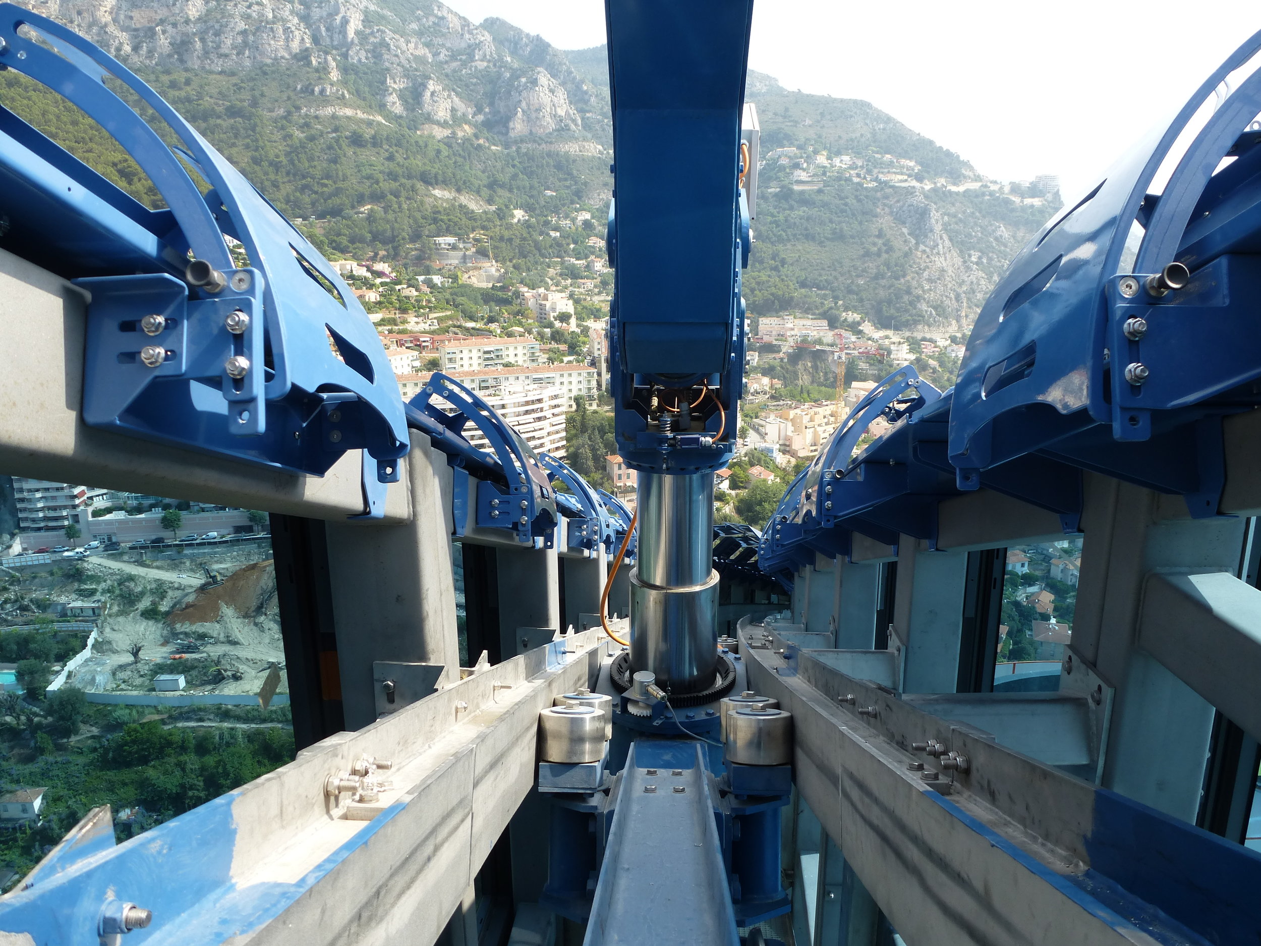 Above: Odeon Tower BMU's feature a rack & pinion drive system with guiding rollers to ensure smooth and stable drive along the very narrow curved inclined path.
