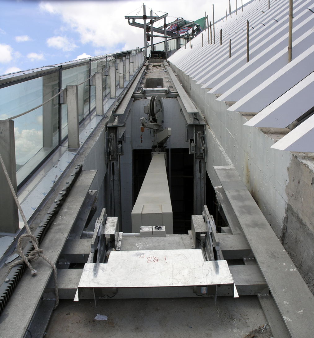 Above: The 2 climbing machines utilize a scissor lift to lower and hide them when not in operation.