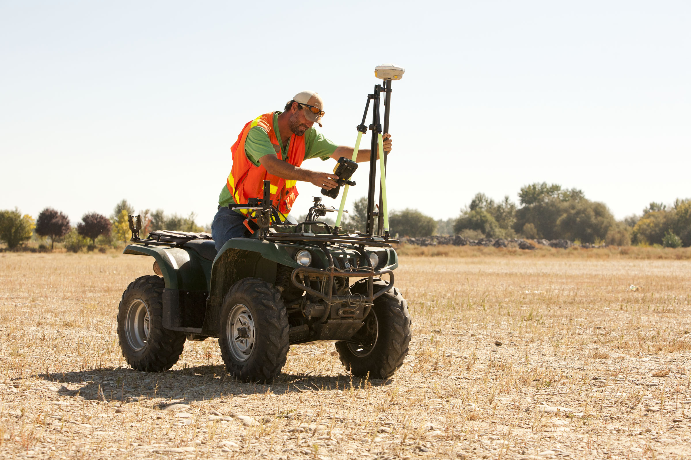 surveyor performing survey on four wheeler