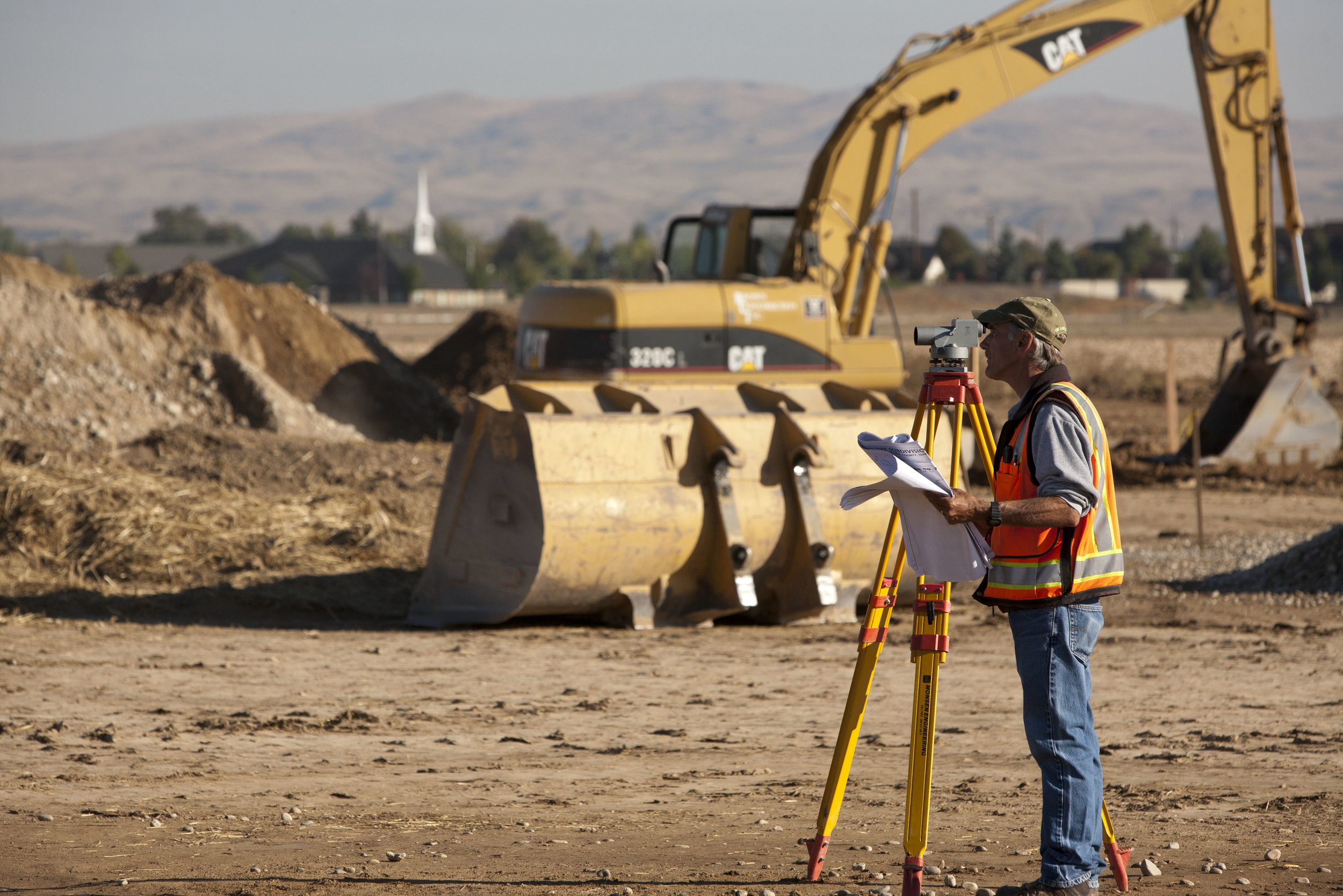 surveyor using surveying tools