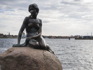 The Little Mermaid guards the port to Nyhavn. One of the most visited attractions in Copenhagen. A must on our walking tour.