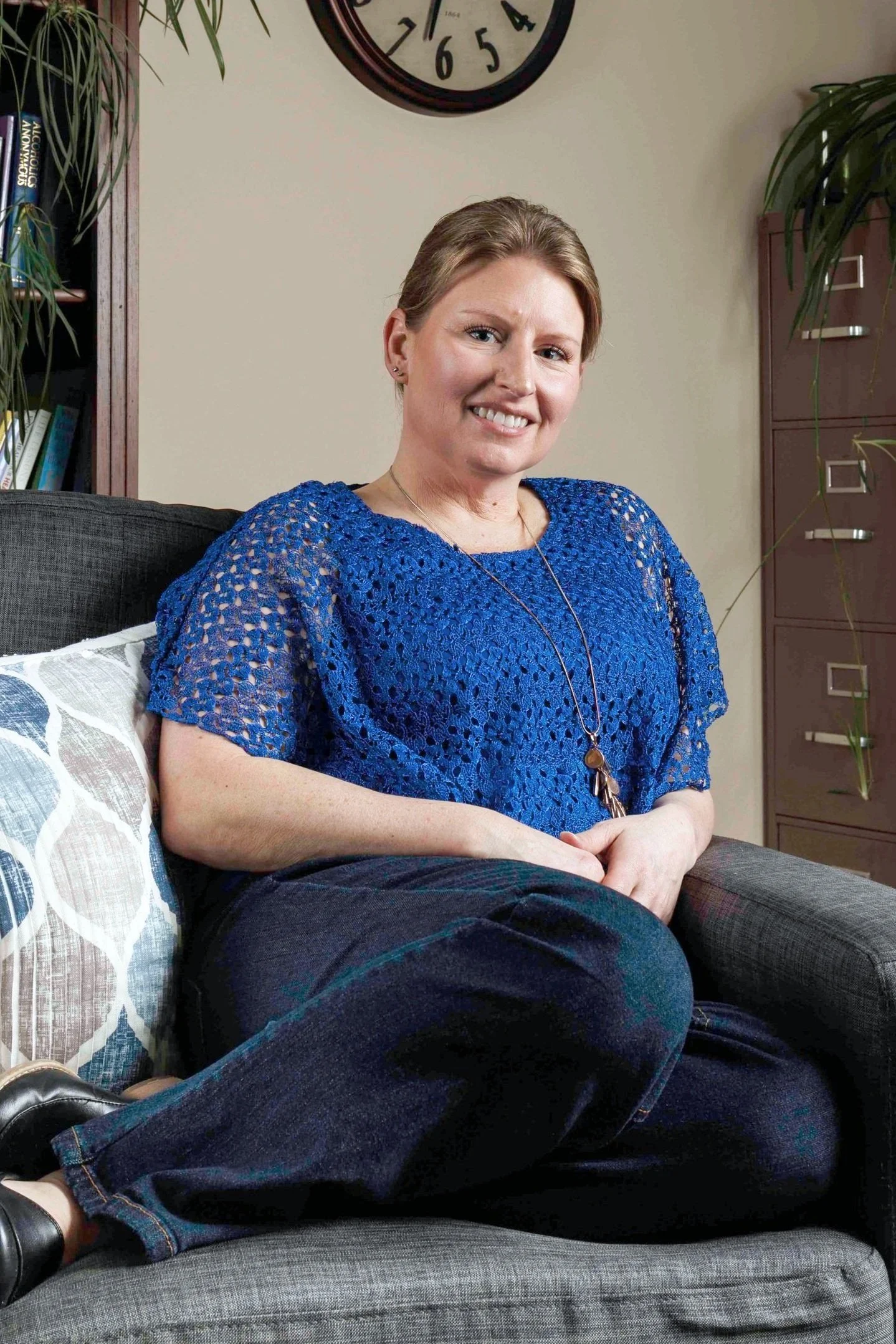 Rachel Baker, anxiety counseling, sitting in chair in office.