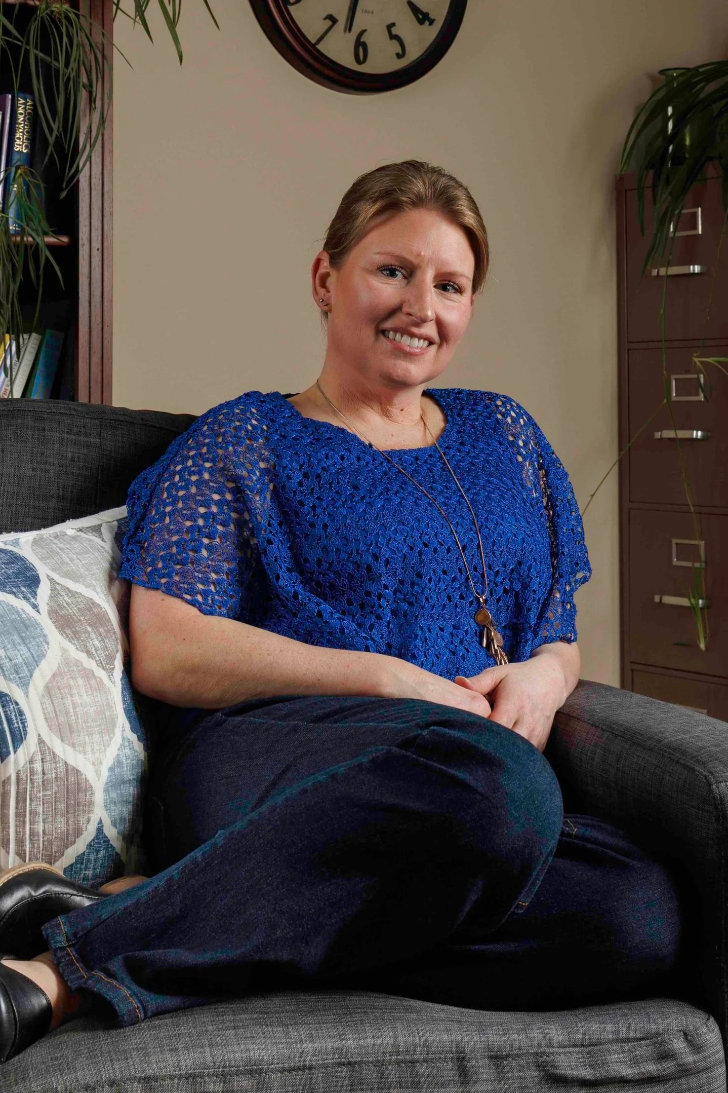 Rachel Baker, anxiety therapist in Spokane Washington, sitting in her office.